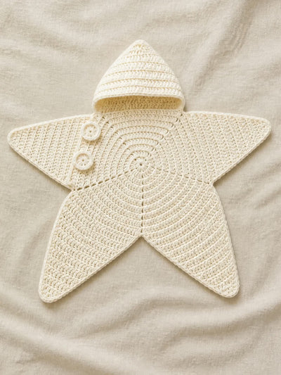 Hand-crocheted starfish suit in Cloud White, flat lay