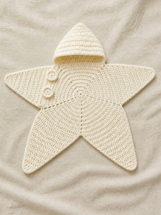 Hand-crocheted starfish suit in Cloud White, flat lay