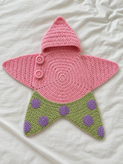 Hand-crocheted starfish suit in Pinky Green, flat lay